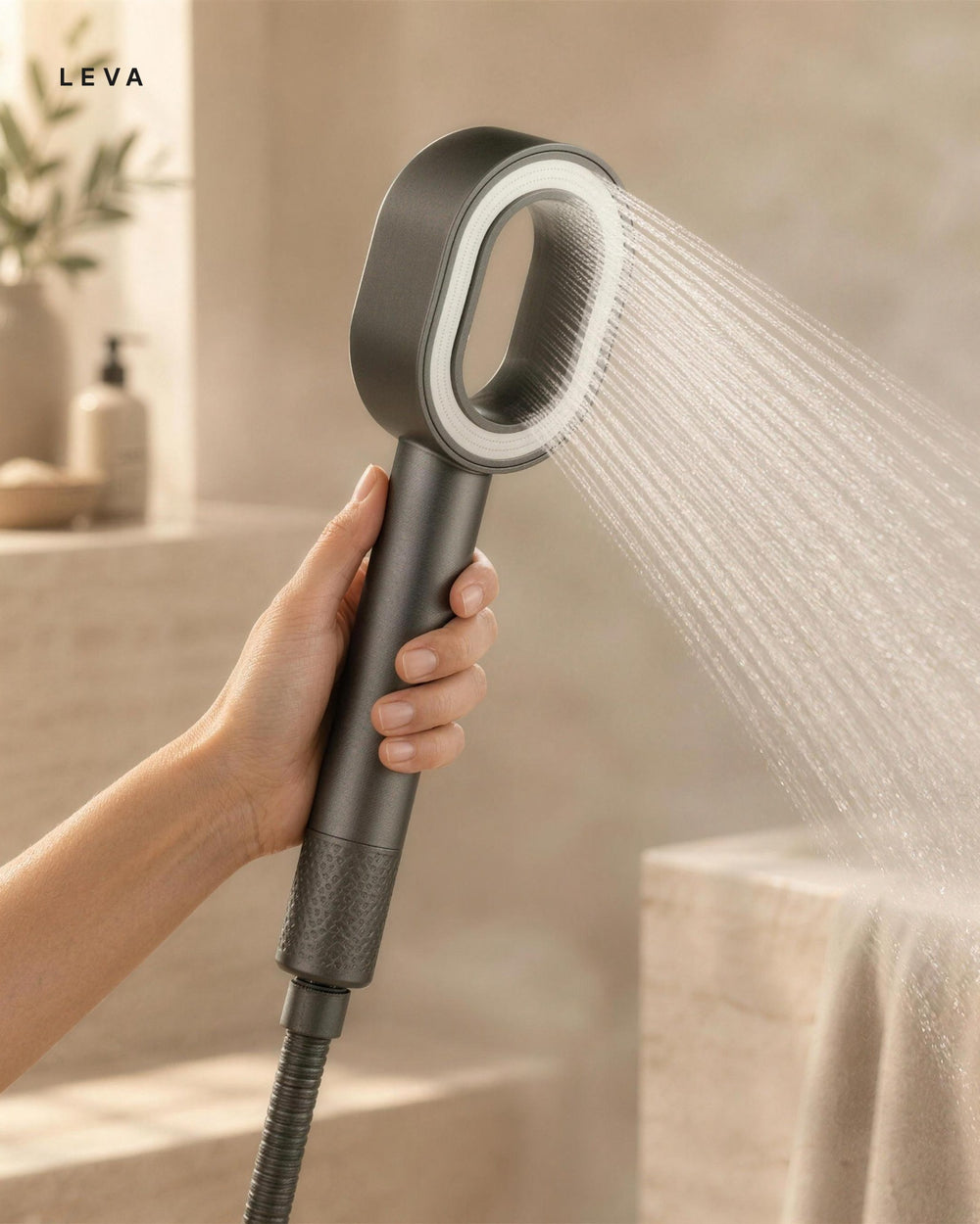Leva in hand with water flowing