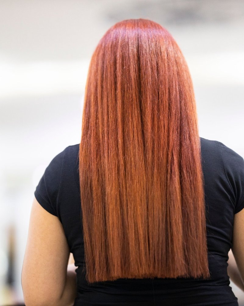 Long, glossy copper-red hair