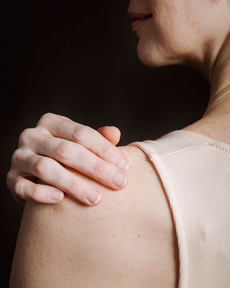 Hand resting on a smooth shoulder