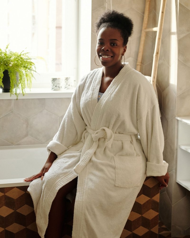 Smiling woman in a white robe